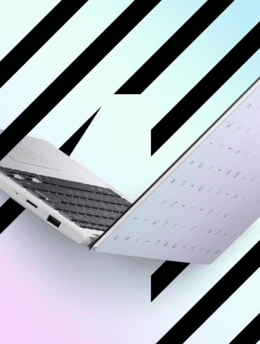 Open ASUS E410 laptop against colourful graphic ackground