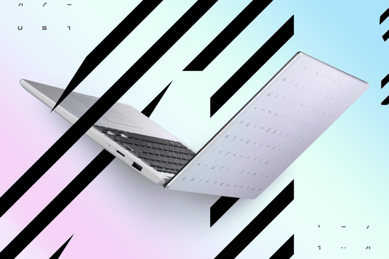 Open ASUS E410 laptop against colourful graphic ackground