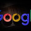 Image of the Google logo in neon lights against a dark background