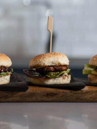 Picture of three Mzansi Meat Co burgers lined up next to each other