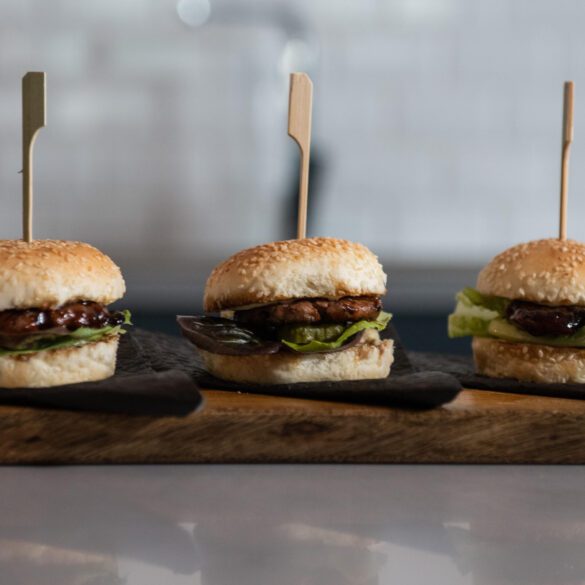 Picture of three Mzansi Meat Co burgers lined up next to each other