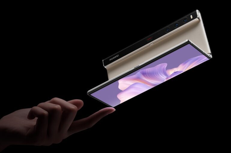 Image of a person balacing a partially open Huawei Mate Xs 2 on their fingertip