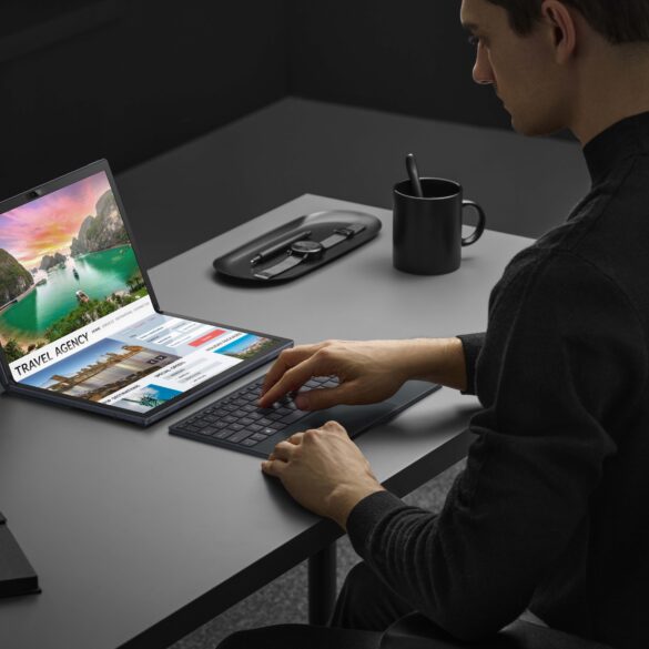 product image of the ASUS Zenbook Fold laptop being used in its folded position on an office desk setup