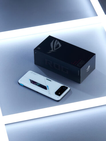 ASUS ROG Phone 6 next to phone box surrounded by LED lights