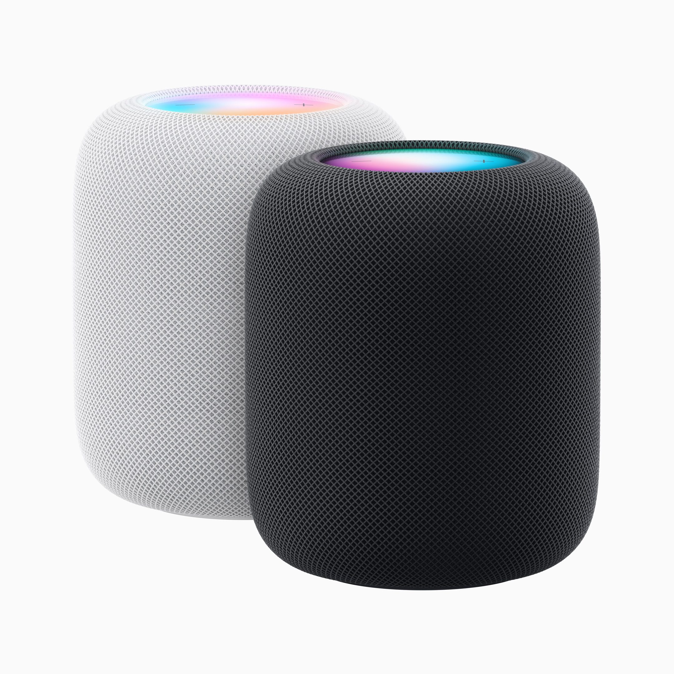 A pair of the new Apple HomePod smart speakers, 1 in black and 1 in white