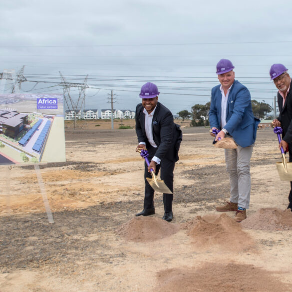 Image of three men holding shovels at the groundbreaking of the new Africa Data Centres location in Cape Town