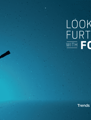 Image of a man holding a looking glass to echo the looking further with Ford tag line