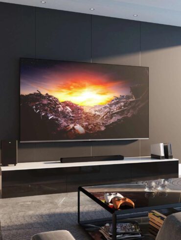 TCL TV mounted on wall in living room