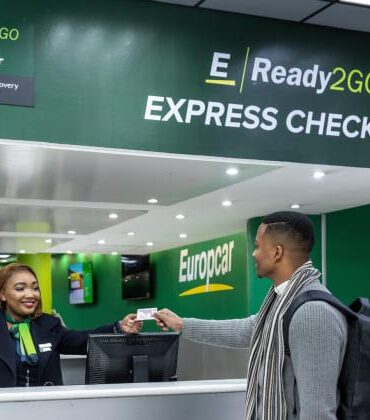 Image of a man getting his keys from Eurpcar car rental assistant as part of the Ready2GO service now available to Discovery Bank clients.