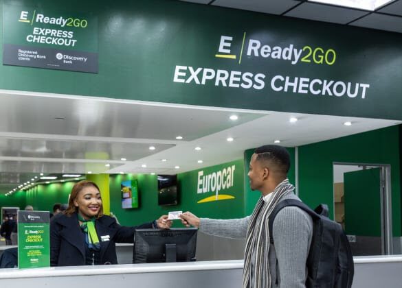 Image of a man getting his keys from Eurpcar car rental assistant as part of the Ready2GO service now available to Discovery Bank clients.