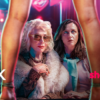 Image of two women looking through a woman's open legs. There is a neon background. This is the poster image for the new Showmax Original series named Koek.